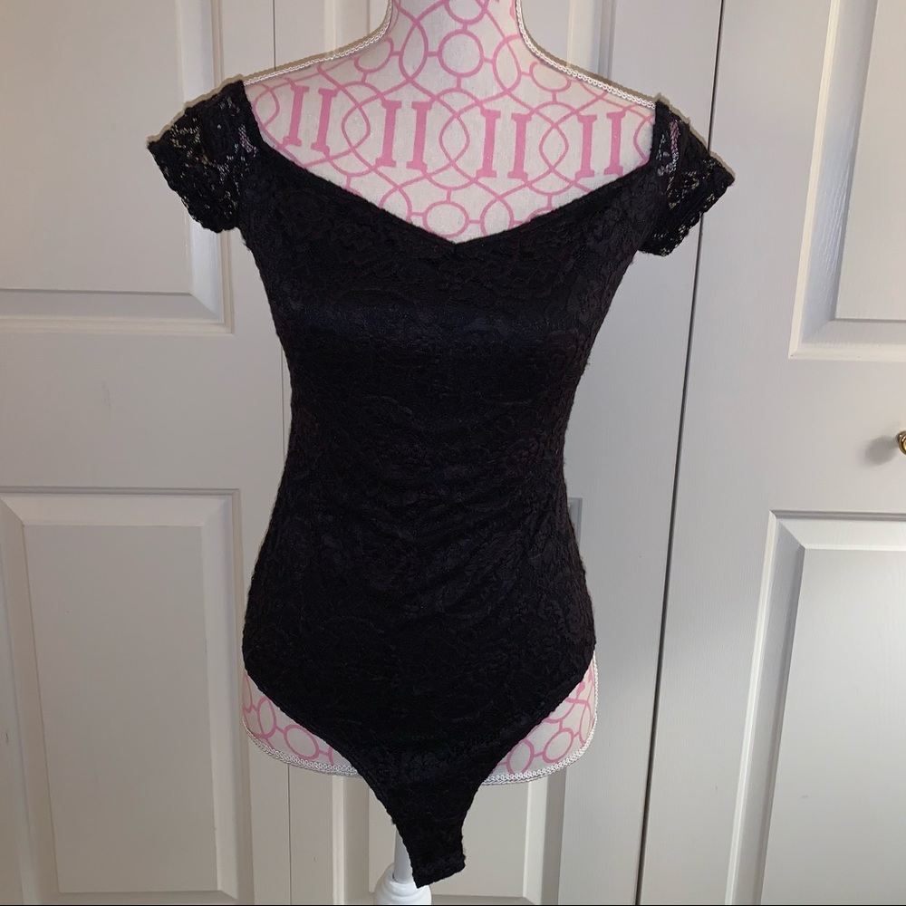 Love, fire off the shoulder body suit size medium
